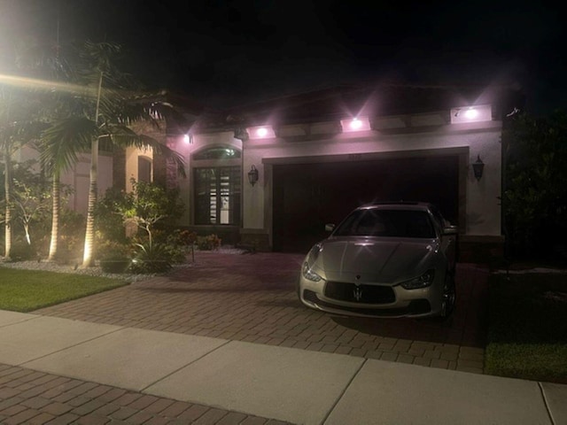 view of front of property with a garage