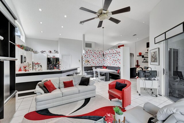 living room featuring light tile patterned floors and ceiling fan