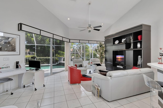 tiled living room featuring high vaulted ceiling, ceiling fan, and a healthy amount of sunlight