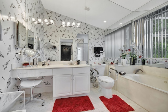 bathroom featuring vanity, tile patterned floors, a tub to relax in, and toilet