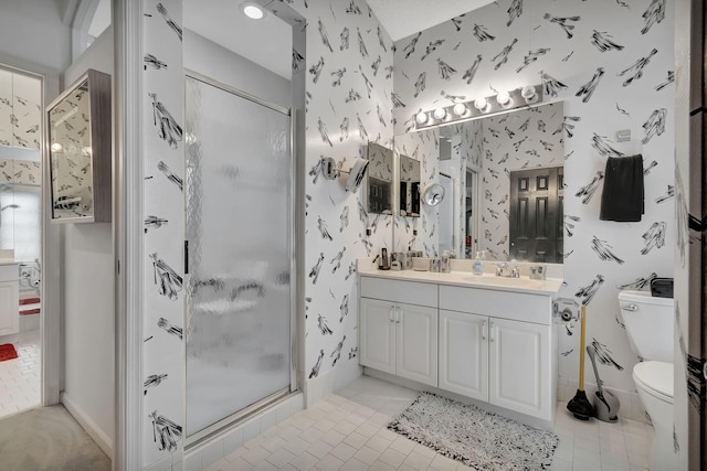 bathroom with tile patterned flooring, toilet, vanity, and an enclosed shower