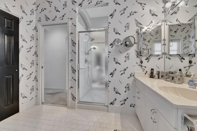 bathroom with vanity, tile patterned floors, and an enclosed shower