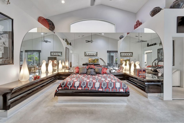 bedroom featuring carpet and high vaulted ceiling