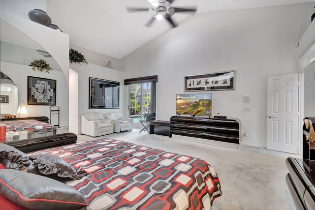 carpeted bedroom with high vaulted ceiling and ceiling fan