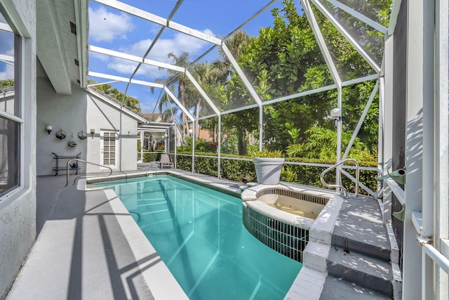 view of pool with a patio and glass enclosure