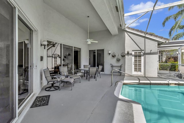 view of swimming pool with a lanai, a patio, and ceiling fan