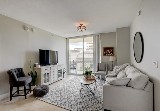 tiled living room with a wall of windows