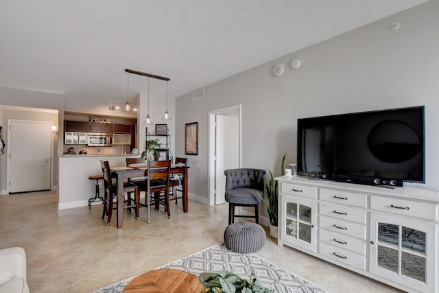 dining area with light tile patterned flooring