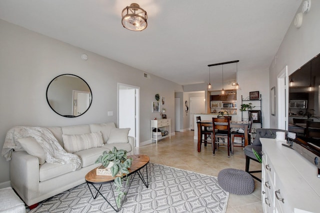 living room with light tile patterned floors