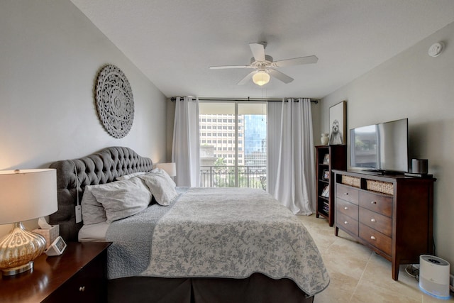 tiled bedroom featuring ceiling fan