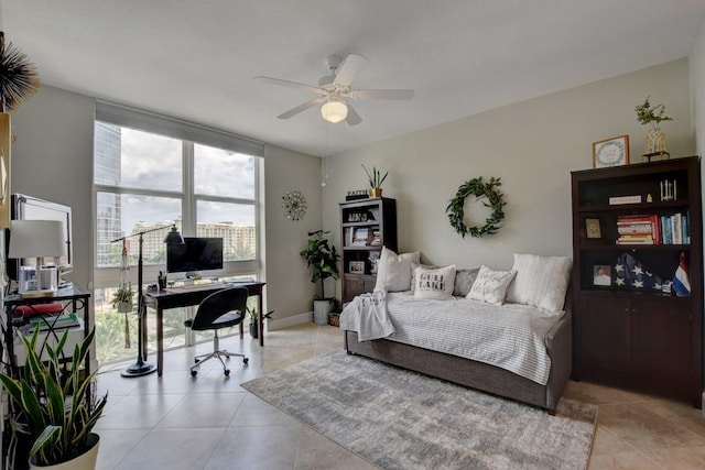 bedroom featuring light tile patterned floors and floor to ceiling windows