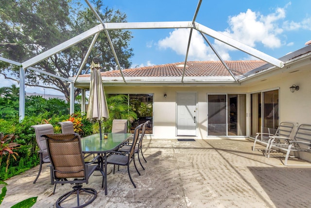 view of patio / terrace with a lanai