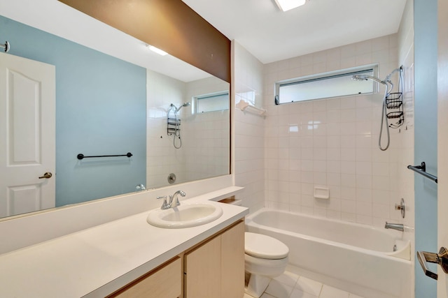 full bathroom with tile patterned flooring, vanity, toilet, and tiled shower / bath