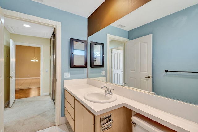 bathroom with tile patterned flooring and vanity