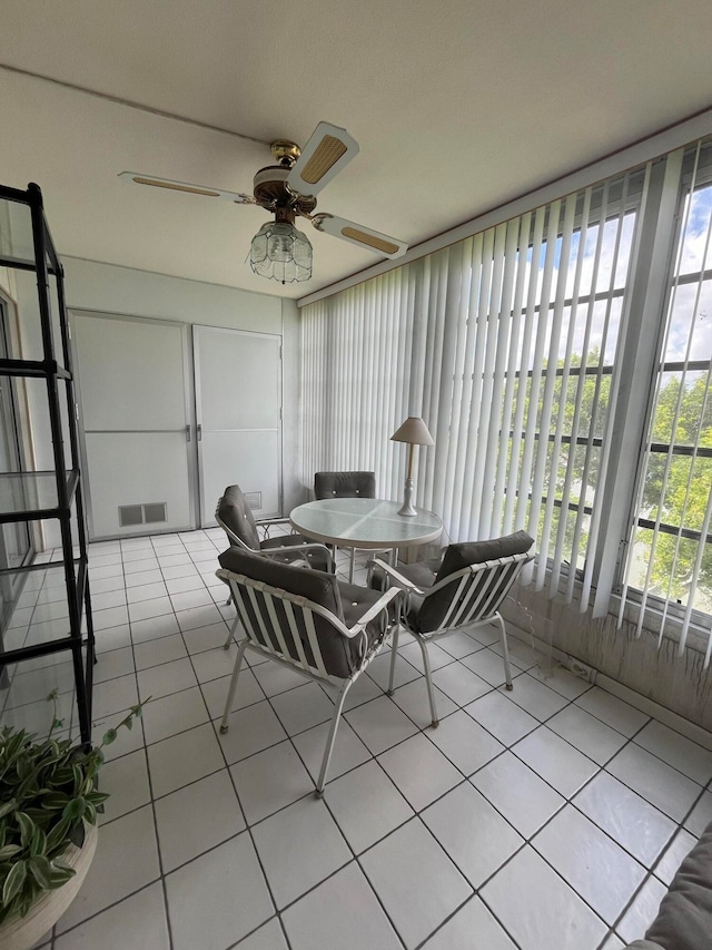 sunroom / solarium with ceiling fan