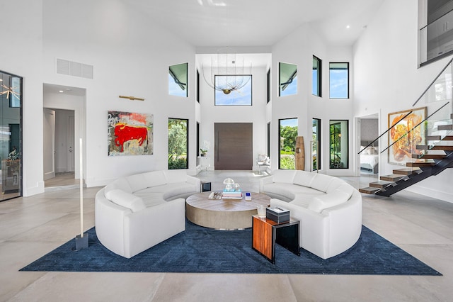 living room featuring a towering ceiling