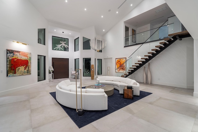 living room featuring light tile patterned floors and high vaulted ceiling