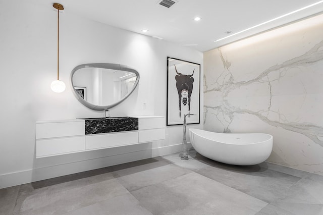 bathroom with tile patterned flooring and tile walls