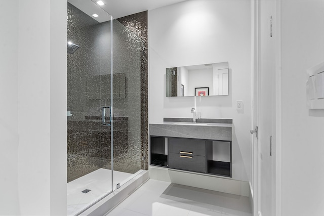 bathroom featuring vanity, an enclosed shower, and tile patterned flooring