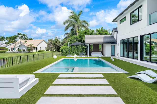 view of pool with a patio and a yard