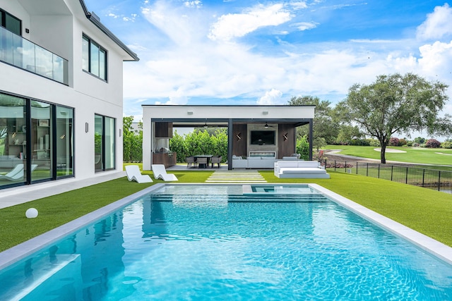 view of pool with a patio area, ceiling fan, and a lawn