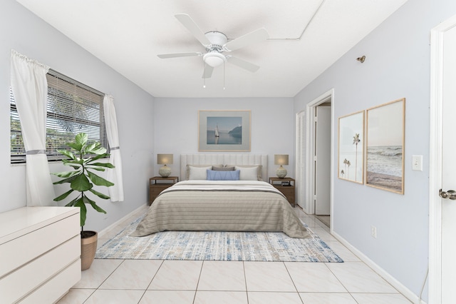 bedroom with ceiling fan and light tile patterned floors