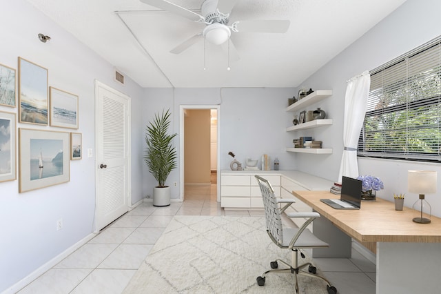 office space featuring ceiling fan and light tile patterned floors