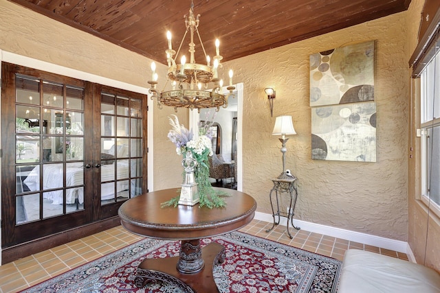 dining space featuring an inviting chandelier, wooden ceiling, tile patterned floors, and french doors