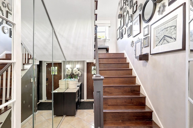 staircase with tile patterned flooring