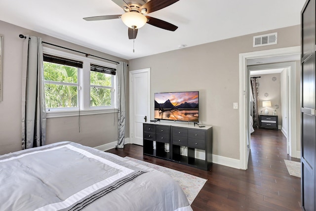 bedroom featuring ceiling fan and dark hardwood / wood-style flooring