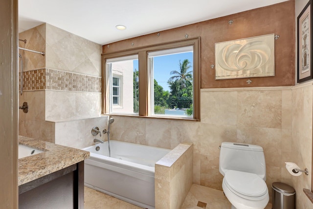 full bathroom with tile walls, tile patterned flooring, vanity, and toilet