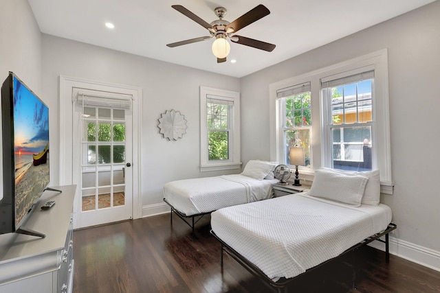 bedroom featuring ceiling fan and dark hardwood / wood-style floors