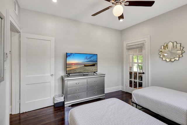 bedroom featuring ceiling fan and dark wood-type flooring