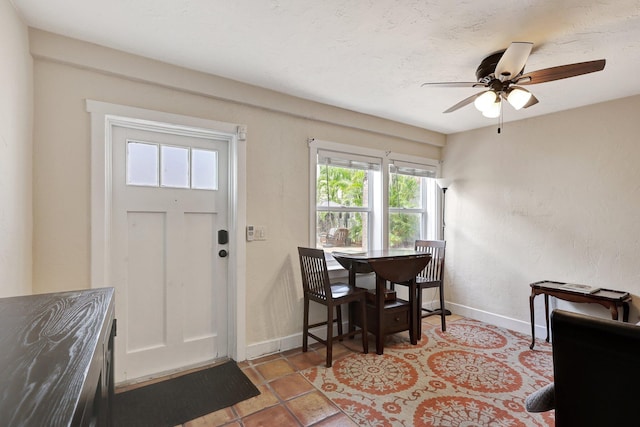 entrance foyer with ceiling fan