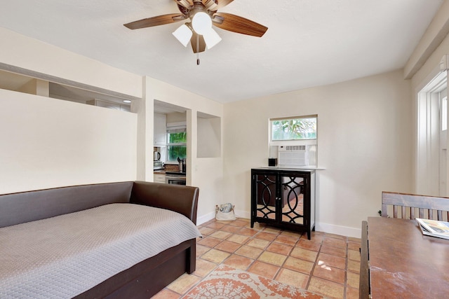 bedroom featuring cooling unit, light tile patterned flooring, and ceiling fan