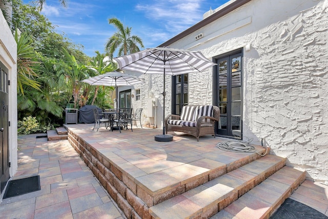 view of patio featuring a grill