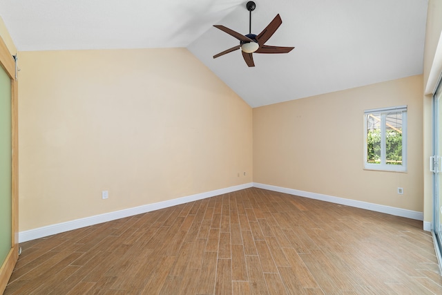 unfurnished room featuring ceiling fan, light hardwood / wood-style flooring, and vaulted ceiling