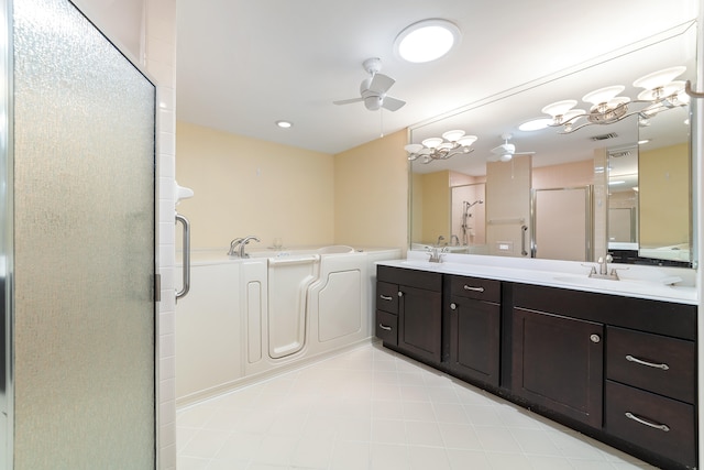 bathroom featuring a shower with door, ceiling fan with notable chandelier, and double sink vanity