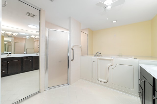 bathroom with walk in shower, tile patterned floors, vanity, and ceiling fan