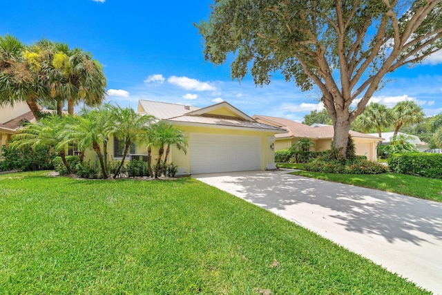 view of front facade with a front lawn and a garage