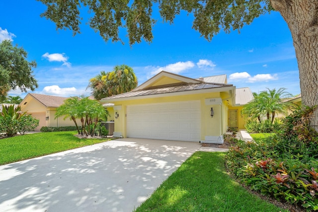 view of front facade with a front lawn and a garage