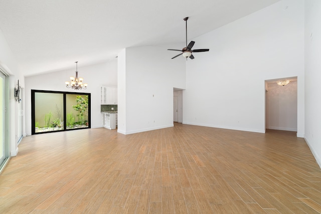 unfurnished living room featuring light hardwood / wood-style flooring, ceiling fan with notable chandelier, and high vaulted ceiling