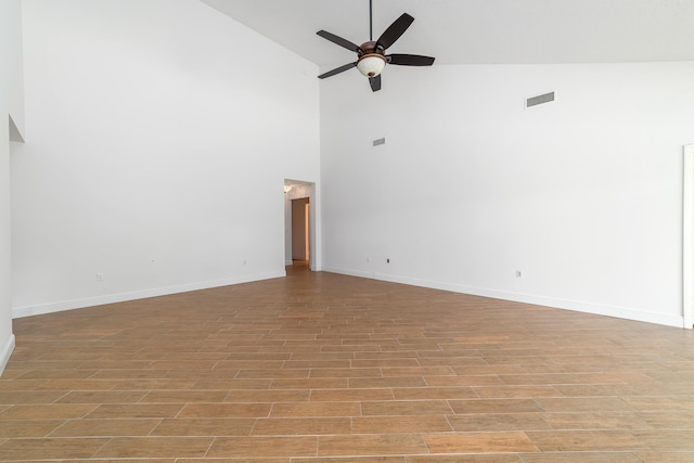 unfurnished room featuring ceiling fan and high vaulted ceiling