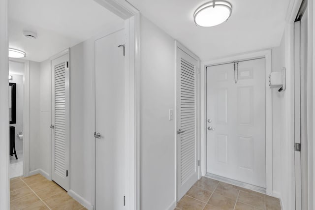 hallway with light tile patterned flooring