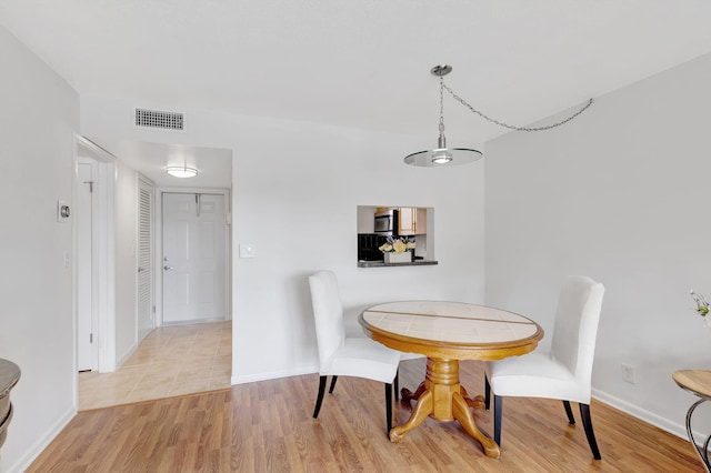 dining area featuring light hardwood / wood-style flooring