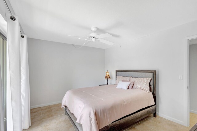 tiled bedroom with ceiling fan