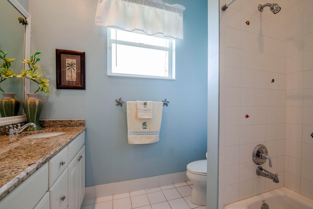 full bathroom with tile patterned floors, toilet, vanity, and tiled shower / bath