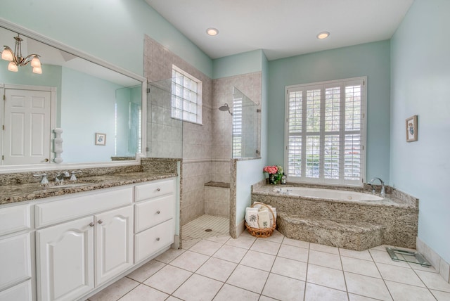 bathroom with plenty of natural light, tile patterned floors, and separate shower and tub