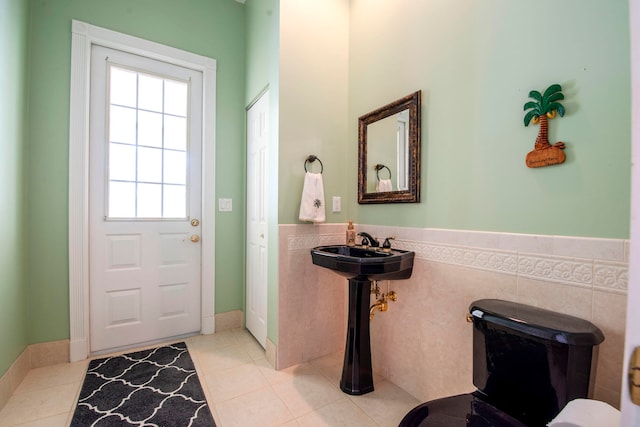 doorway with light tile patterned floors