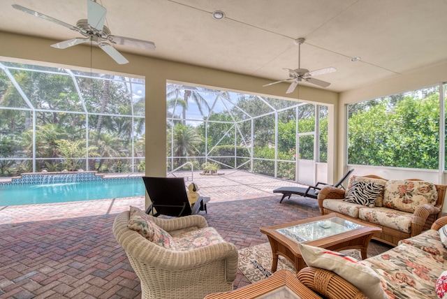 sunroom / solarium featuring ceiling fan and a wealth of natural light